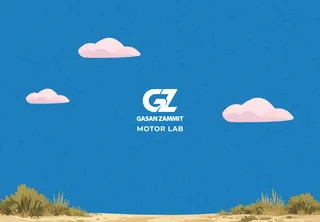 Motor Lab game start screen with the Gasan Zammit Motor Lab logo over a desert and pink clouds
