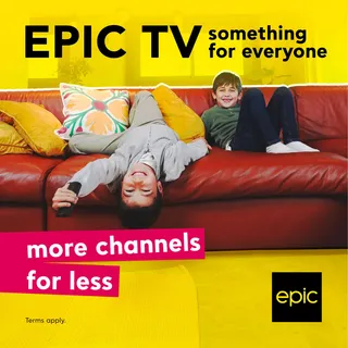 Epic TV advert of a child lying upside down on a red sofa: 'More channels for less'
