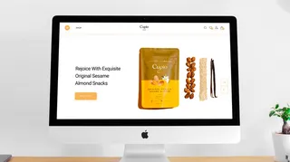 Cupio Snacks website on a desktop monitor showing a pack of sesame almond snacks