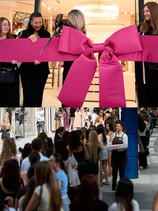 Guests cutting a large pink ribbon at the Victoria's Secret store opening, with a crowd below